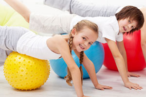 Children exercising - Swiss Ball