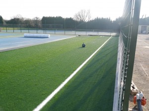 The first pieces of a big jigsaw of carpet are installed.